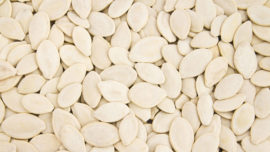 Close-up of pumpkin seeds in bulk.