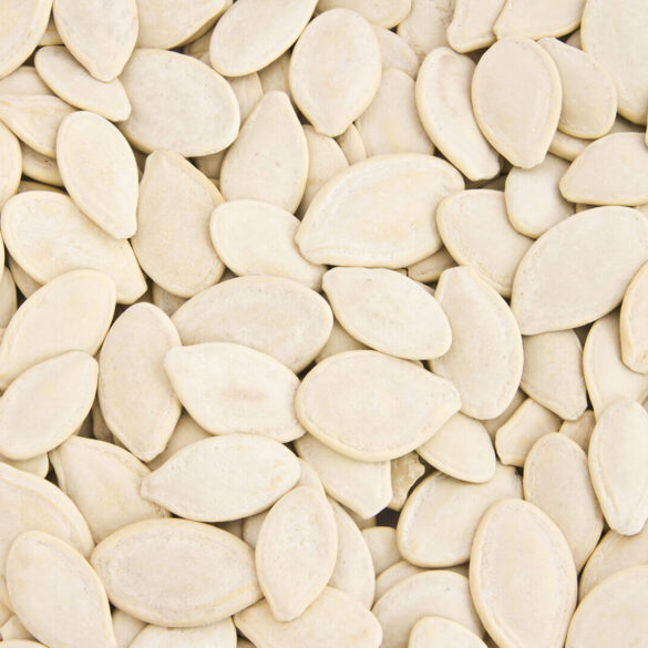 Close-up of pumpkin seeds in bulk.