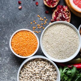 Assorted healthy foods on a dark background.