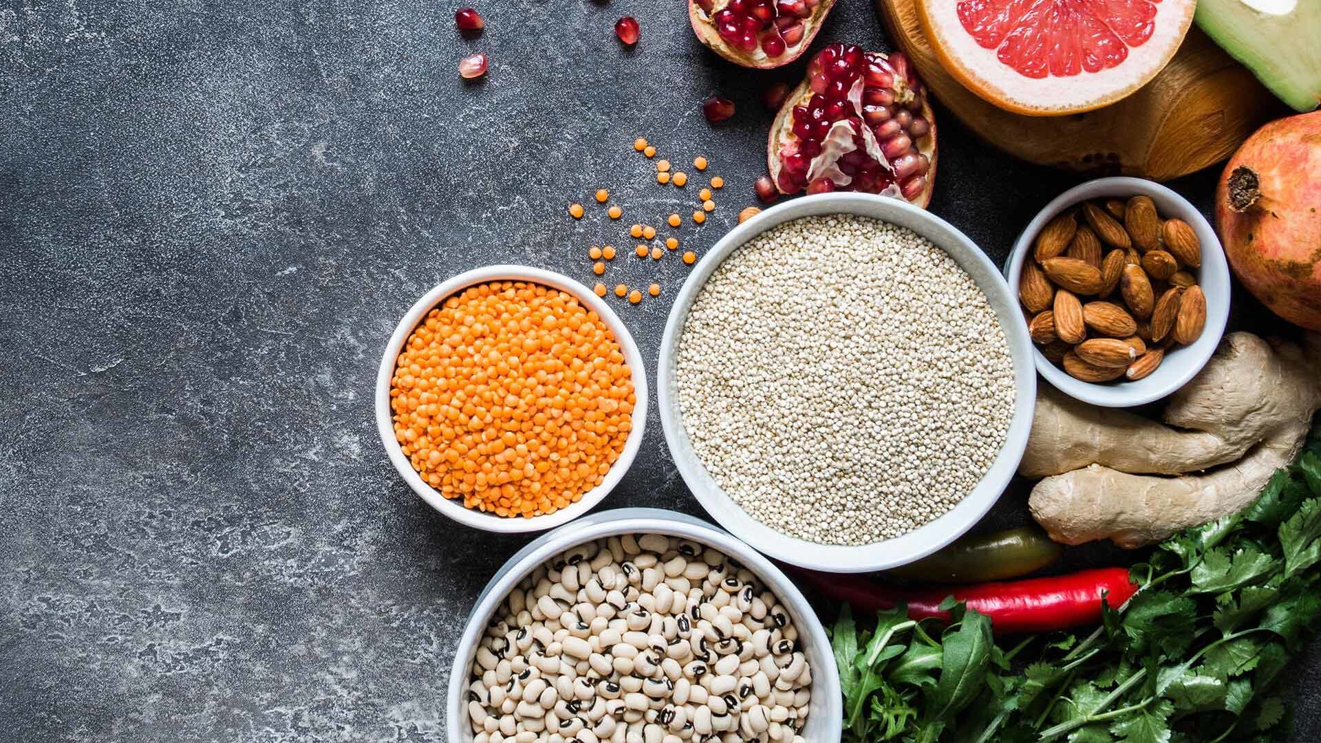 Assorted healthy foods on a dark background.