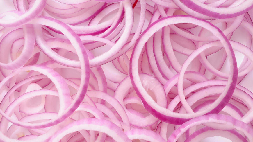 Sliced red onion rings in close-up view.