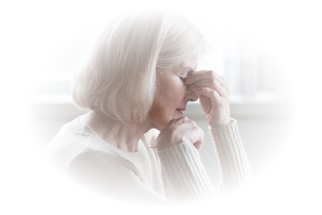 Elderly woman looking stressed and thoughtful.